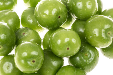 green plums on white