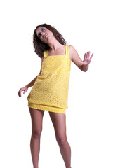 Woman with slim beautiful legs in yellow dress