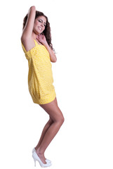 Woman with slim beautiful legs in yellow dress