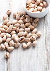 Diet healthcare concept. Roasted pistachio nuts seed with shell close up