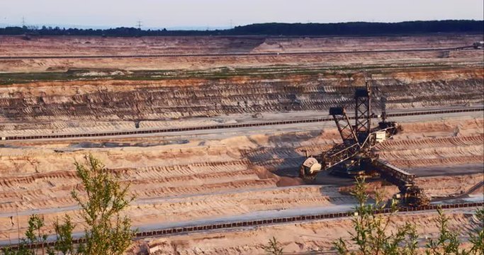 Giant Brown Coal Mine with Bucket Wheel Excavator. Shoot on Digital Cinema Camera in 4k - ProRes 422 codec