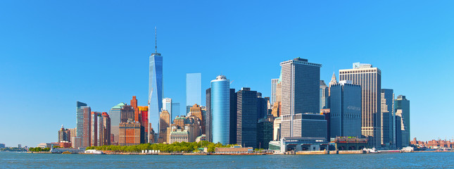 New York City lower Manhattan financial  wall street district buildings skyline on a beautiful...