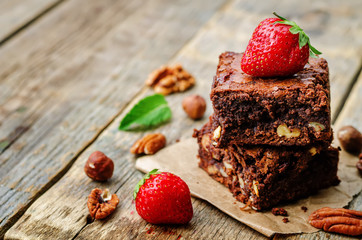 chocolate nut brownie cake decorated with strawberries
