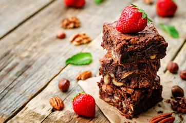 chocolate nut brownie cake decorated with strawberries