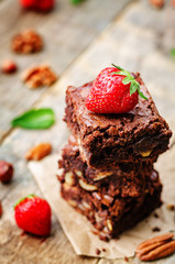 chocolate nut brownie cake decorated with strawberries