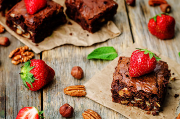 chocolate nut brownie cake decorated with strawberries