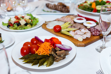pickles and cold cuts at the banquet table