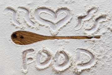 spoon silhouette and text in flour