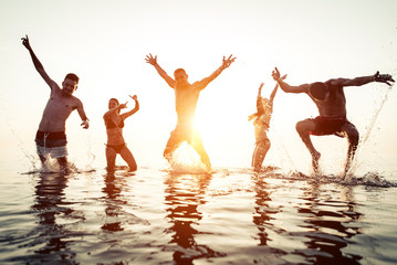 group of friends having fun in the water