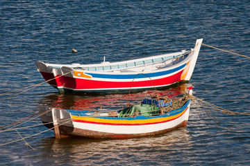 Colorful fishing boats in Algarve, Portugal. © aniad