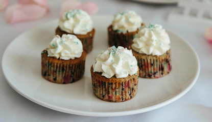 Fresh cup cakes on white plate