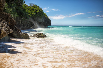 Tropical beach with clear emerald water