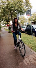 Naklejka premium teenage girl riding a bicycle