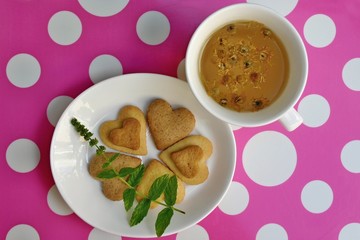 Romantic breakfast: homemade heart-shaped cookies and chamomile tea