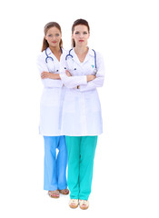 Two woman nurse watching X Ray image, standing in hospital