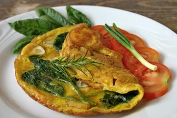 Omelet with potatoes and spinach