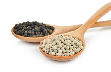 peppercorn in the wooden spoon on white background