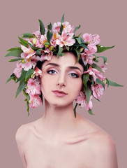 Young woman wearing pink flowers on her head