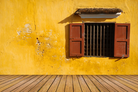 Opened-window On Yellow Wall And Wood Floor