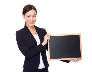 Businesswoman holding with chalkboard