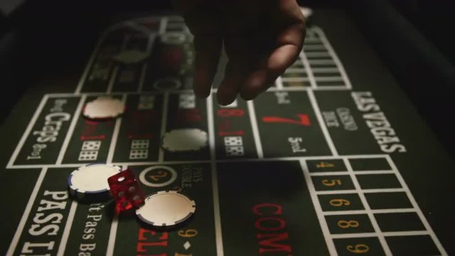Throwing Dice on Craps Game. Shoot on Digital Cinema Camera in 4K  slow motion - ProRes 422 HQ codec.