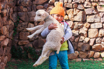 Peruvian girl with a sheep