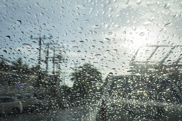 Abstract bokeh from raindrops on glass after rain
