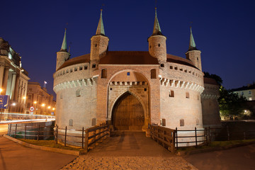 Fototapeta na wymiar Barbican Fortification by Night in Krakow