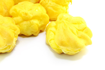 close up of cream puffs isolated on white background