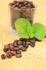 coffee beans and mint leaves.