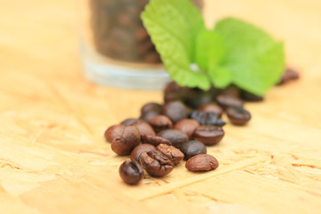 coffee beans and mint leaves.