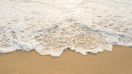 Sea wave and many foot print  on the beach background