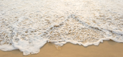 Sea wave and many foot print  on the beach background