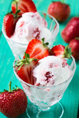 Strawberry ice cream with fresh strawberries, cold summer desser