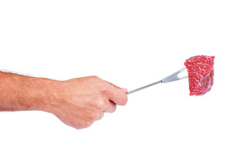 Raw beef on a fork