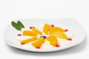 Some fruit on white plate. Isolated on white background.