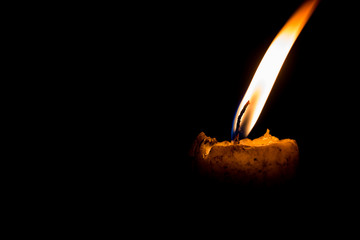 light of yellow candle at night