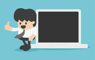 Businessman with thumb up leaning against laptop computer