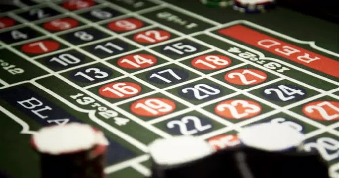 Croupier Putting Chips on Roulette. Roulette is classic casino game.  Shoot on Digital Cinema Camera in 4K - ProRes 422 HQ codec.