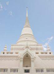 Fototapeta premium Thai Buddhist style white pagoda under blue sky