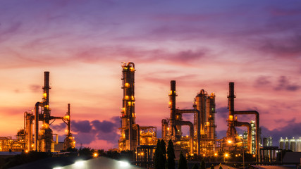 Obraz na płótnie Canvas Big Industrial oil tanks in a refinery with treatment pond at industrial plants
