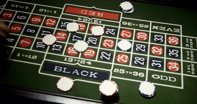 Croupier Putting Chips on Roulette. Roulette is classic casino game Shoot on Digital Cinema Camera in 4K - ProRes 422 HQ codec.