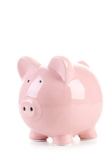 Pink piggy bank isolated on a white