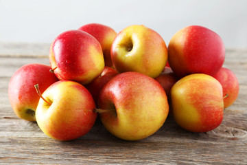 Red apples on grey wooden background