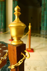 Golden Barrier Post in Stair Hall