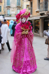 Fototapeta na wymiar Venice Carnival Mask - pink woman mask with flowers