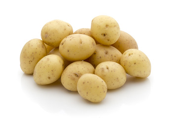 Potatoes on the white background.  New harvest.