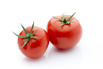 Tomato on the white isolatd background.