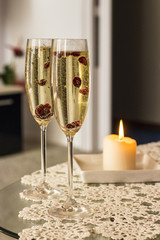Champagne glasses with cranberries