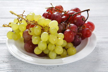 Grapes on a white plate